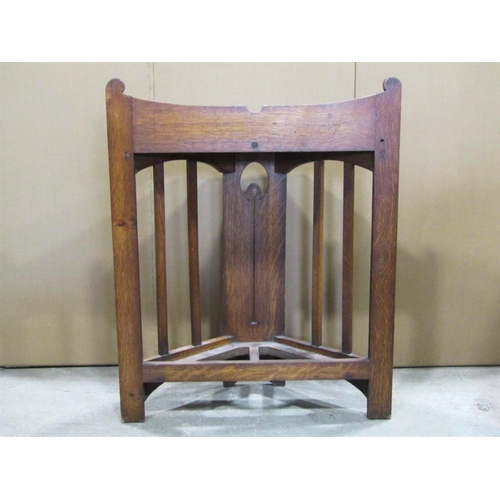 2013 - An arts and crafts oak breakfront floorstanding umbrella stand, with canted open slatted sides flank... 