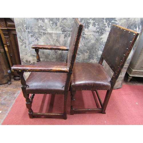 2124 - A set of six (4+2) Cromwelian style oak framed dining chairs, with hide upholstered seats and back p... 