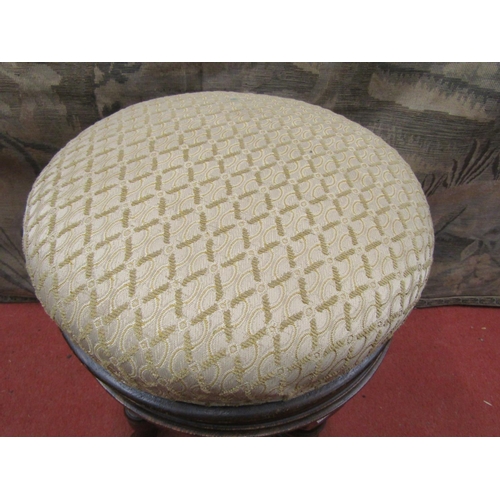 2147 - A late 19th century piano stool with circular revolving and rising seat, raised on four turned suppo... 