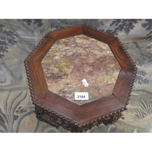 2164 - 19th century Chinese hardwood jardiniere stand of octagonal form with inset marble top raised on fou... 