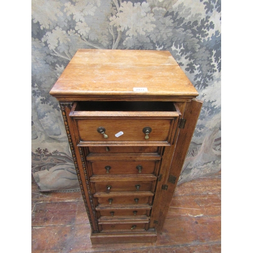 2173 - An Edwardian oak Wellington chest comprising seven drawers, with applied repeating moulded detail an... 