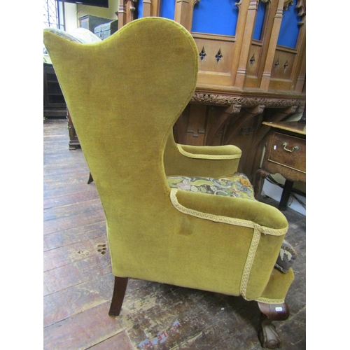 2188a - A 19th century upholstered wing chair raised on claw and ball feet with hand worked tapestry seat an... 