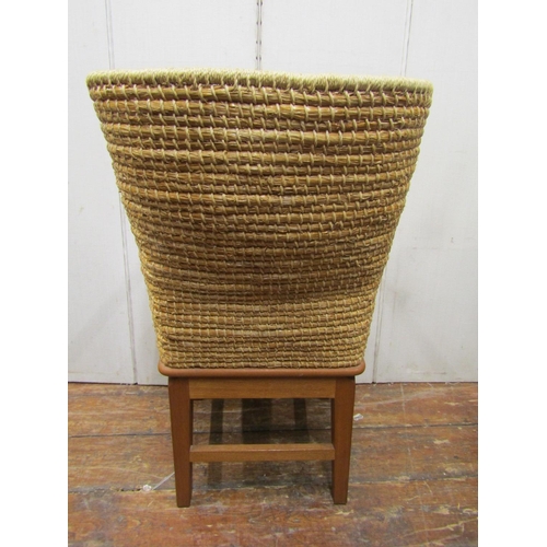 2121 - An Orkney chair - mid 20th century, in oak with straw work canopy back, makers stamp DM Kirkness of ... 