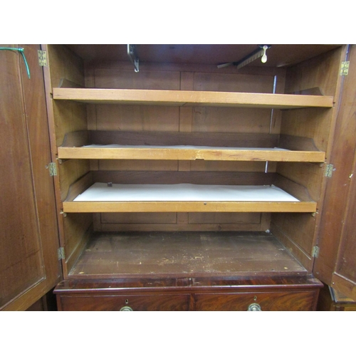 2122 - A William IV mahogany linen press, the lower section enclosed by two long and two short drawers, the... 