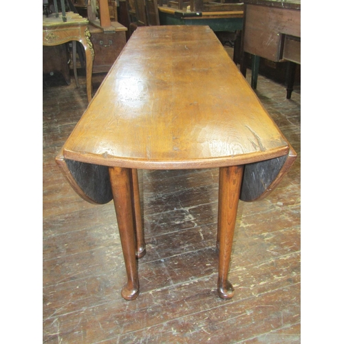 2131 - A high quality oak wake table, mid 20th-century in an 18th century manner, the well figured top rais... 