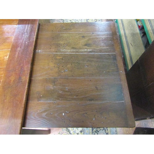 2133 - A good quality French provincial cherry wood dining table with plank top, raised on four square cut ... 