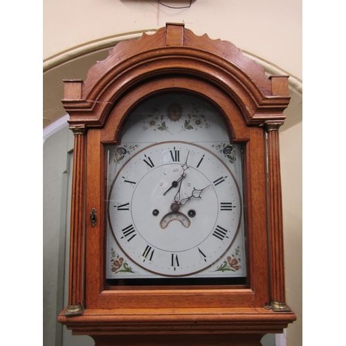 2134 - A Georgian oak Countrymade longcase clock, the arched hood enclosing broken arch painted dial with f... 