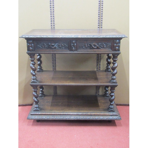 2136 - A mid Victorian period oak three tier buffet of rectangular form, with barley twist supports, enclos... 