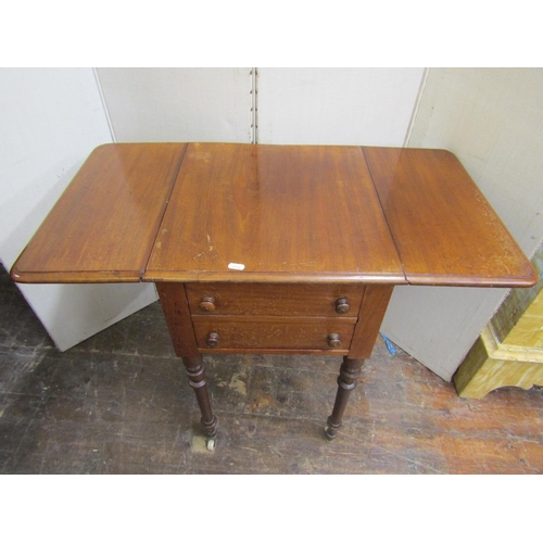 2140 - A mid 19th century mahogany drop-leaf side table, enclosed by four dummy drawers (one acting as a cu... 