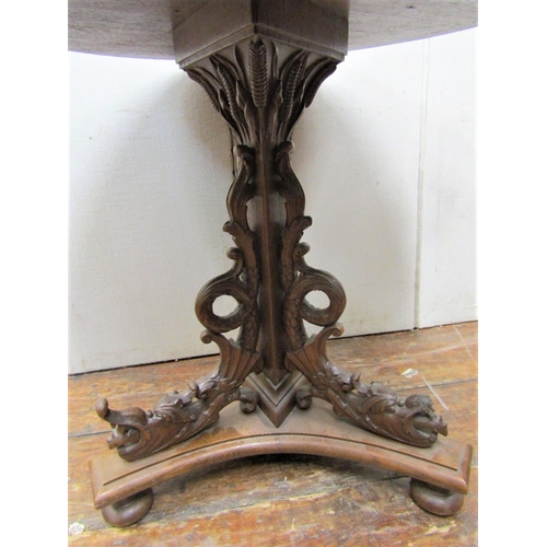 2141 - A mid Victorian period oak occasional table, the circular top 65cm diameter, raised on a tri-corn co... 