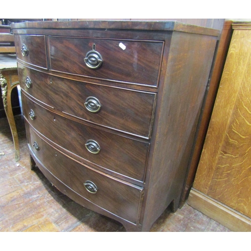 2143 - A regency mahogany bow fronted chest of three long and two short drawers, the top cross banded and r... 