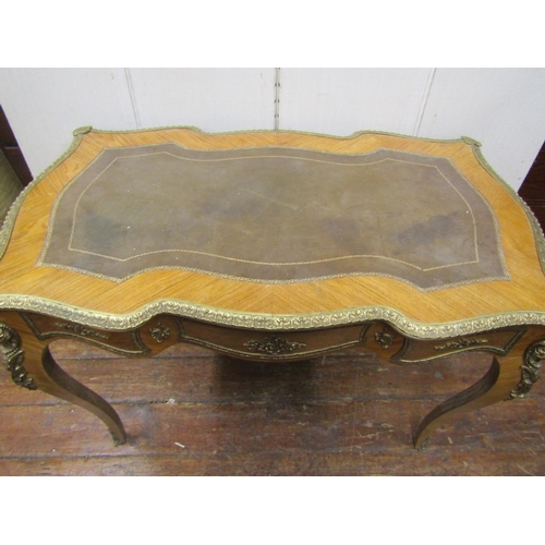 2145 - A Louis XV style writing desk of shaped outline, raised on four cabriole supports, enclosing three f... 