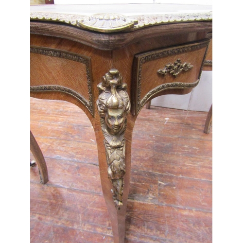 2145 - A Louis XV style writing desk of shaped outline, raised on four cabriole supports, enclosing three f... 
