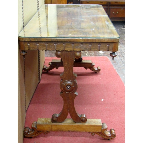 2154 - An early Victorian rosewood centre table of rectangular form, raised on a stretcher base with scroll... 