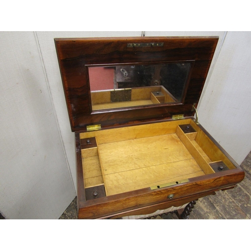 2160 - A mid-19th century rosewood ladies sewing table, the rising lid enclosing a mirro with birds eye map... 