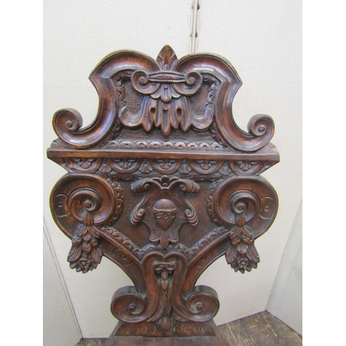 2169 - 19th century continental walnut hall chair of flamboyant design, the seat with dished centre, the ba... 