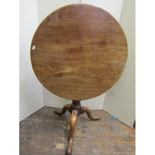 2177 - A Georgian mahogany snap-top table with circular one piece top, 71cm diameter, raised on a vase shap... 