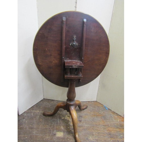 2177 - A Georgian mahogany snap-top table with circular one piece top, 71cm diameter, raised on a vase shap... 