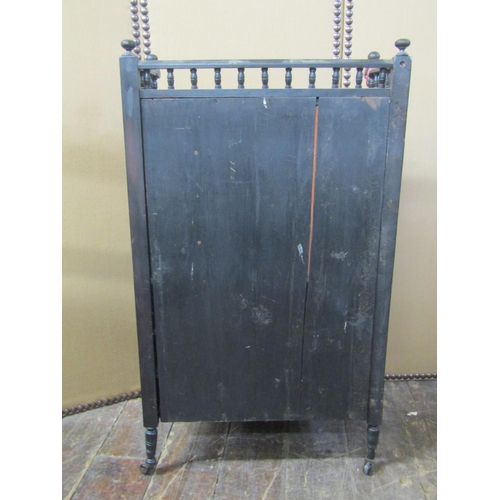 2181 - A Victorian aesthetic movement side cabinet with ebonised finish, the lower section enclosed by a pa... 