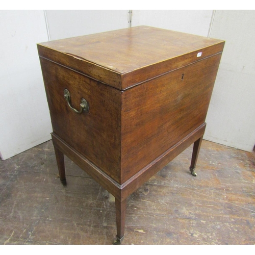 2183 - A Georgian mahogany cellarette of box form with brass carrying handles, raised on square cut support... 