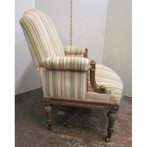 2185 - A French armchair with carved and gilded show wood frame, with reeded and spiral twist supports, flo... 