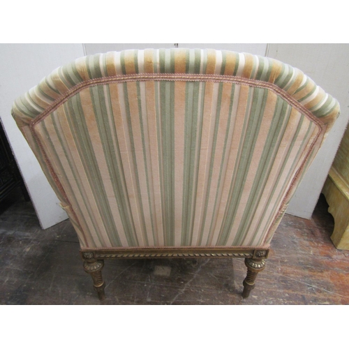 2185 - A French armchair with carved and gilded show wood frame, with reeded and spiral twist supports, flo... 