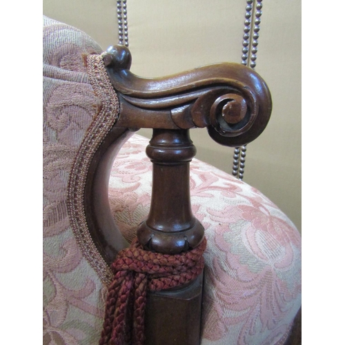 2188 - A Victorian drawing room sofa of small proportions, with carved walnut show wood frame, the shaped s... 