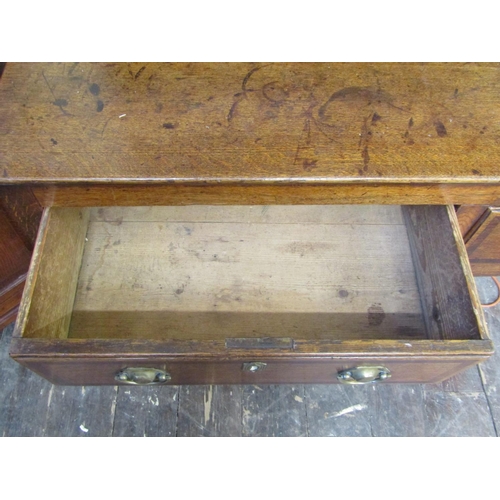 2194 - A Georgian oak Welsh dresser and plate rack, the base enclosed by three frieze drawers, crossbanded ... 