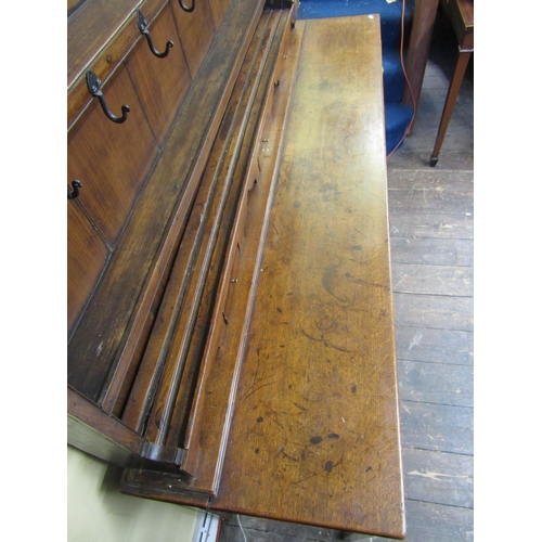 2194 - A Georgian oak Welsh dresser and plate rack, the base enclosed by three frieze drawers, crossbanded ... 