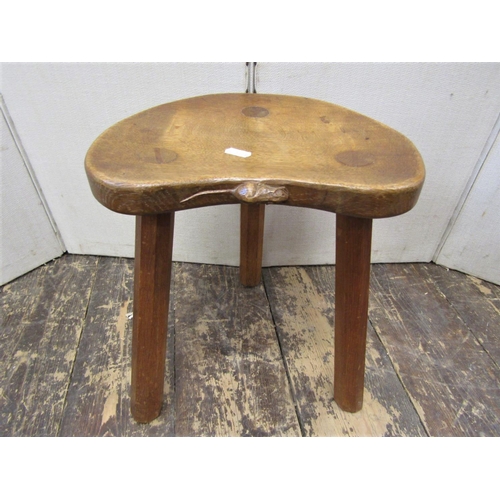 2196 - A Thompson of Kilburn Mouseman stool, raised on three simple tapering supports