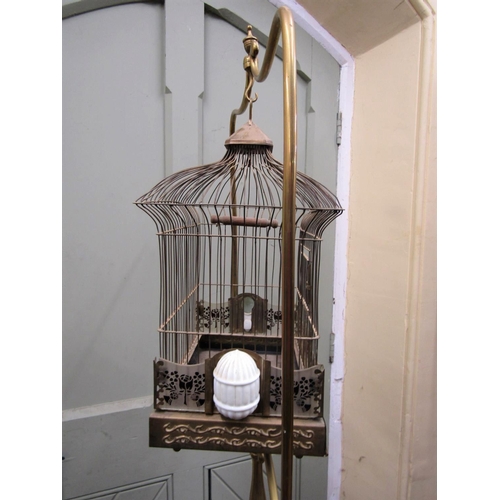 2198 - A good Victorian brass bird cage with wire work panels, set upon a brass framework of full height, w... 
