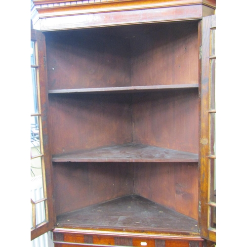 2199 - A Georgian oak freestanding corner cupboard, the lower section enclosed by two panelled doors, the u... 
