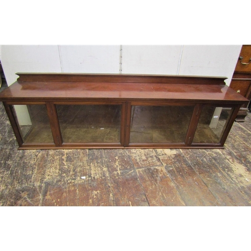 2200 - A 19th century mahogany cabinet of horizontal form, enclosed by a pair of glazed panelled doors and ... 