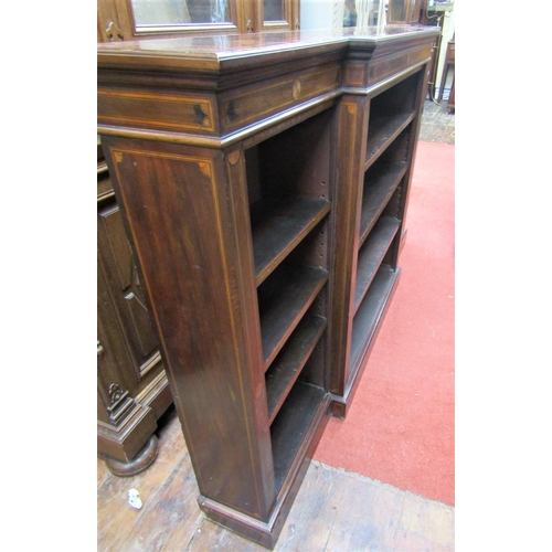 2200B - An Edwardian mahogany breakfront bookcase of narrow proportions enclosing an arrangement of adjustab... 