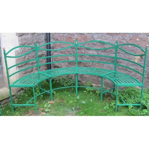 1675 - A pair of Regency style green painted light steel framed four seat sectional curved benches with str... 