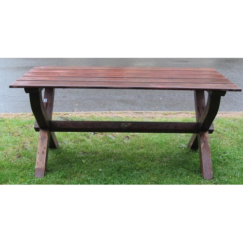 1676 - A hardwood garden/tavern table of rectangular form with plank top raised on x framed supports united... 