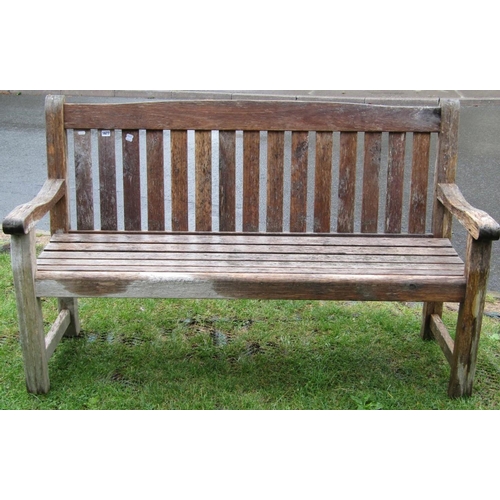 1677 - A weathered teak three seat garden bench with slated seat and back, 5ft long