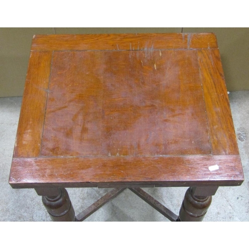 1861 - An unusually small oak draw-leaf dining table, raised on tuirned baluster supports united by a X fra... 