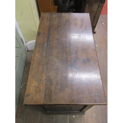 2107 - An antique oak side cupboard enclosed by a pair of fielded panelled doors (af) 84cm wide