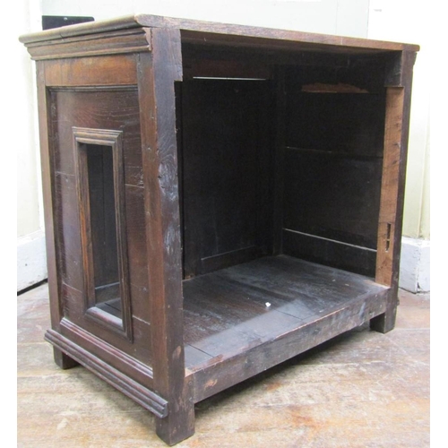 2107 - An antique oak side cupboard enclosed by a pair of fielded panelled doors (af) 84cm wide