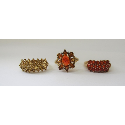 871 - Three 9ct yellow / orange stone dress rings to include a citrine example, all size S, 10.5g total (3... 