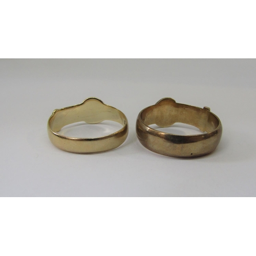 882 - Two 9ct buckle rings, sizes U & T, 8g total (2)