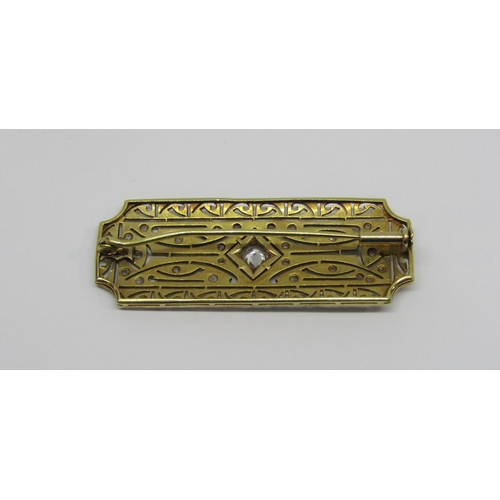 933 - Art Deco diamond plaque brooch of openwork design, unmarked bi-colour metal, 4.7 x 1.7cm approx, 8.3... 