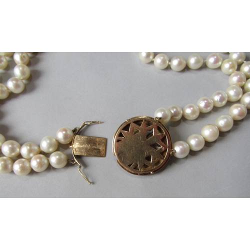 938 - Double strand pearl necklace with associated antique rose cut diamond set circular clasp, in unmarke... 