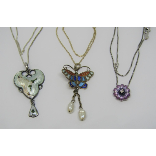 958 - Three enamelled silver pendant necklaces comprising a butterfly example with twin baroque pearl drop... 