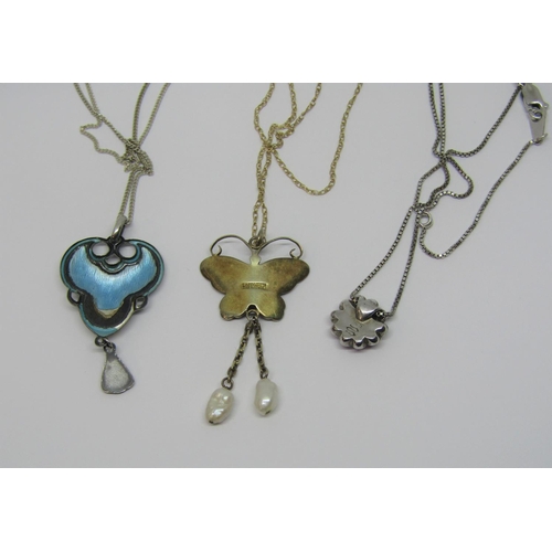 958 - Three enamelled silver pendant necklaces comprising a butterfly example with twin baroque pearl drop... 