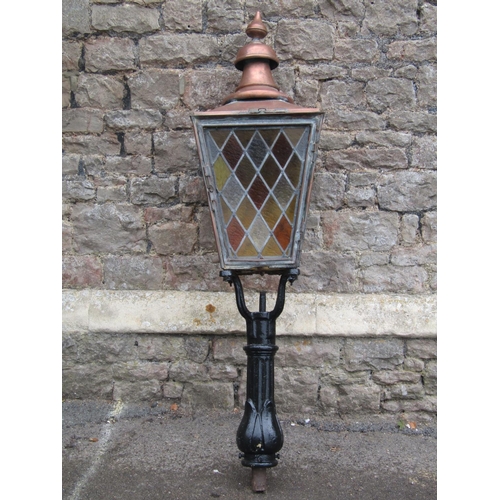 1684 - A Victorian street lantern the copper square tapered hood with raised finial and enclosed by possibl... 