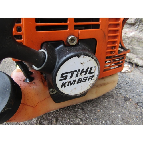 1727 - A Stihl KM85R petrol engine/combi garden tool with hedge trimmer attachment, circular blade and prun... 