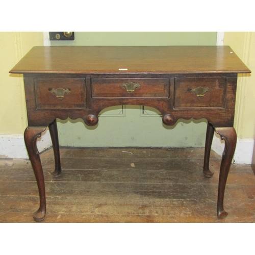 2115 - A 19th century oak side table or low boy, fitted with three drawers, crossbanded in walnut, with sha... 