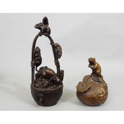 105 - A collection of five oriental bronzes, one of a rat upon a fruit, another of rats scrabbling around ... 